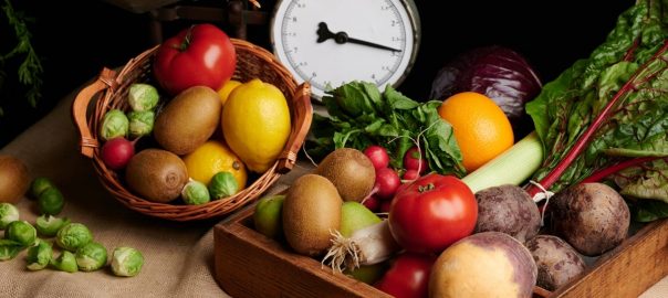 a wooden box filled with lots of different types of vegetables
