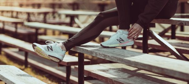 Athlete tying shoes on the bench at the track!